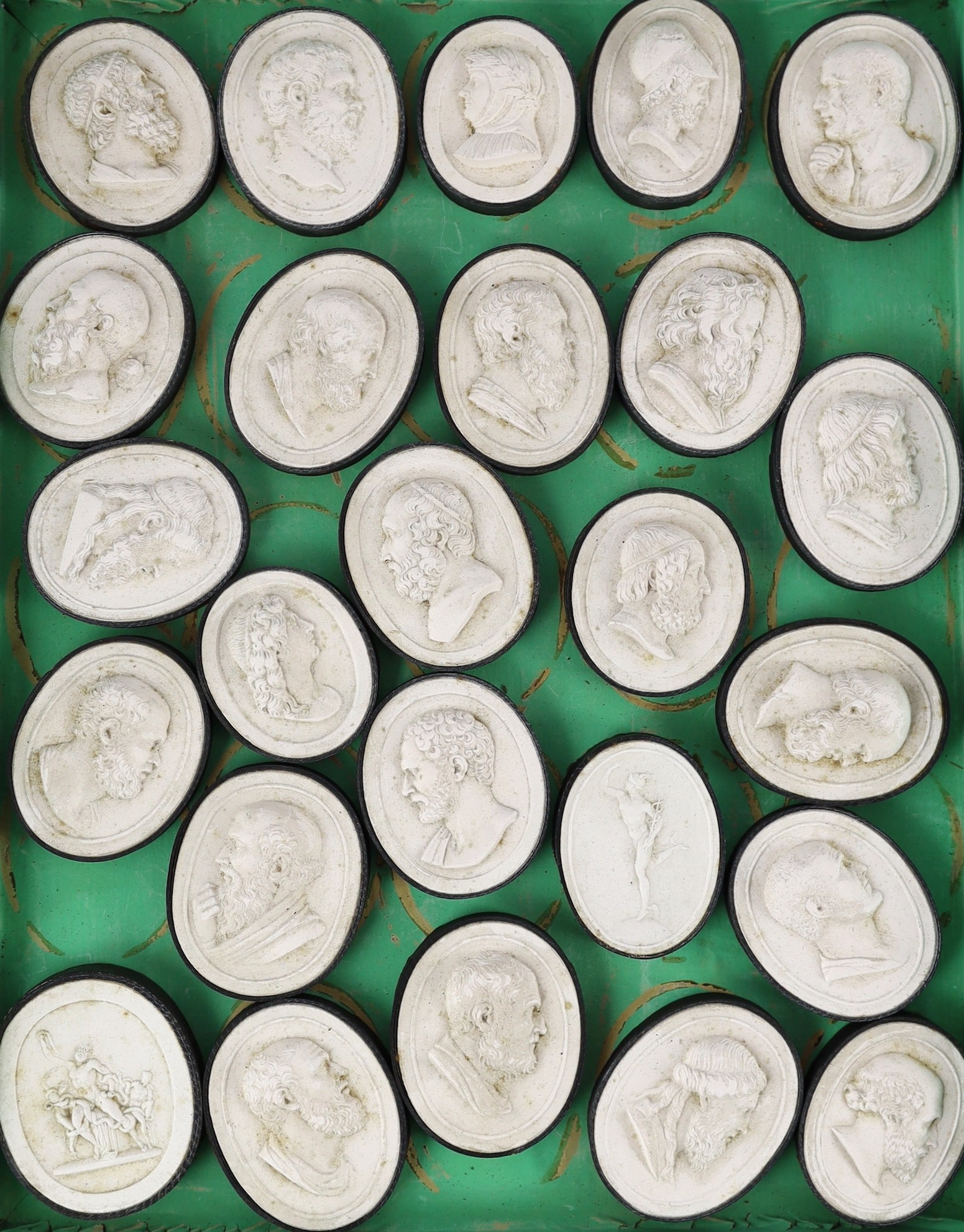 A cased set of eighty three Italian Grand Tour plaster roundels after intaglios of various subjects, box 29 x 22.5cm, largest cameo 5 x 4cm